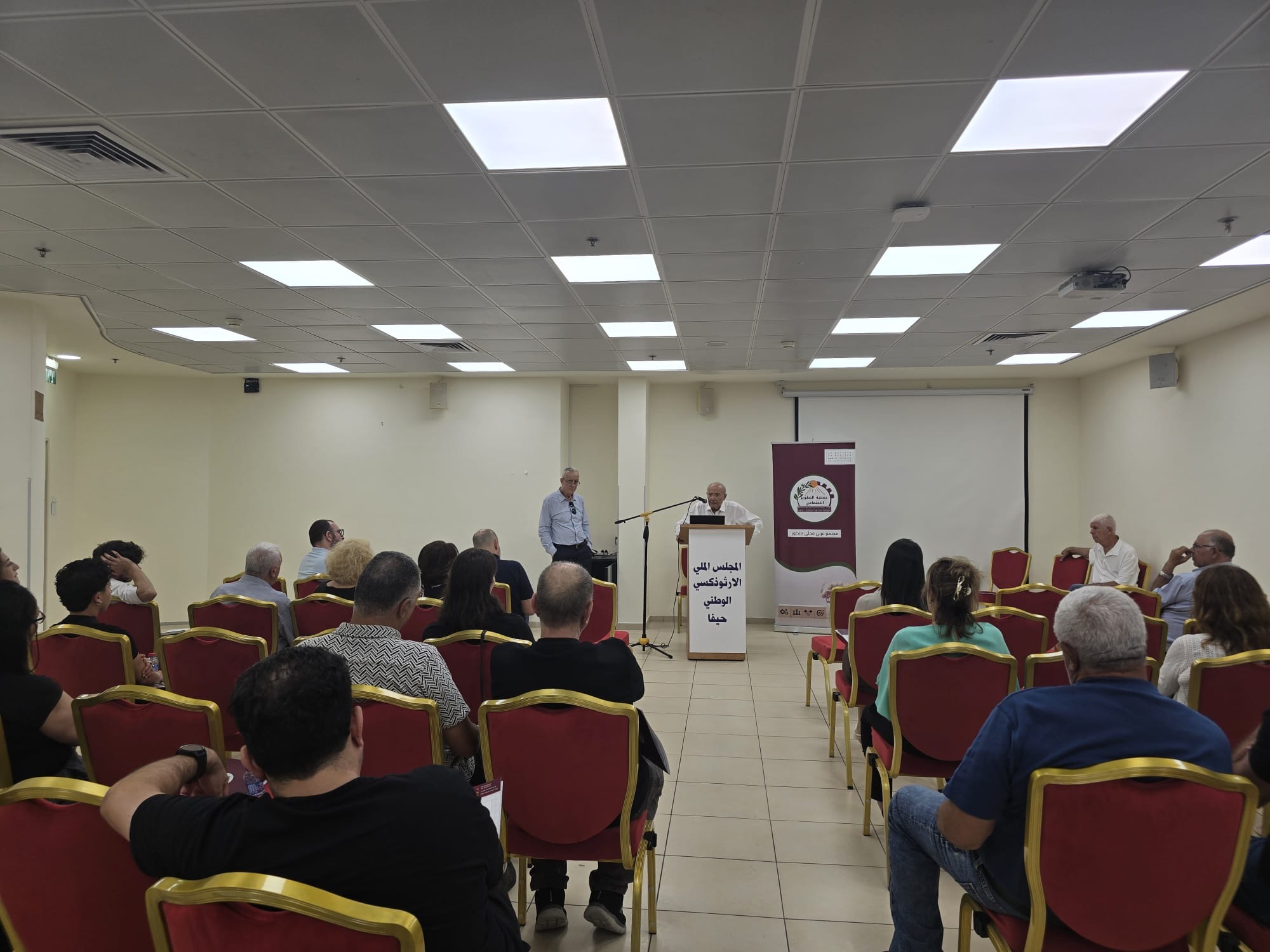 Wide view of the hall from the rear during the Arab Civic Council founding assembly, Haifa, 1 July 2026.